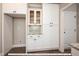 White kitchen pantry with granite countertop and glass-front cabinets at 775 Vick Rd, Spring Hope, NC 27882