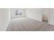 Spacious bedroom with gray carpet and access to a walk-in closet at 164 Periwinkle Pl # 28, Clayton, NC 27527