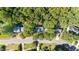 Neighborhood view showcasing a tree-lined street and multiple homes at 117 Torrey Pines Dr, Clayton, NC 27527
