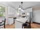 Kitchen with white cabinets, stainless steel appliances and breakfast nook at 117 Torrey Pines Dr, Clayton, NC 27527