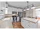 Kitchen with white cabinets, stainless steel appliances, and an island at 117 Torrey Pines Dr, Clayton, NC 27527