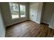 Bright bedroom with hardwood floors and a double door closet at 230 Grading Stick Ct, Angier, NC 27501