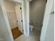 Walk-in closet with toilet and shelving at 230 Grading Stick Ct, Angier, NC 27501