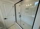 Modern shower with glass enclosure and herringbone tile floor at 230 Grading Stick Ct, Angier, NC 27501