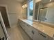 Double vanity bathroom with quartz countertops and a large mirror at 230 Grading Stick Ct, Angier, NC 27501