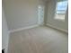 Spacious bedroom with plush carpet and large window at 230 Grading Stick Ct, Angier, NC 27501