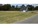 Two story home with gray siding and attached garage at 230 Grading Stick Ct, Angier, NC 27501