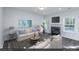 Living Room with fireplace and plenty of natural light at 9200 Leaning Post Rd # 451, Wake Forest, NC 27587