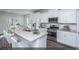 Modern kitchen with white cabinets, granite countertops, and stainless steel appliances at 9200 Leaning Post Rd # 451, Wake Forest, NC 27587