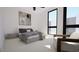 Spacious bedroom with large windows and a comfortable bed at 512 Gordon St # 302, Durham, NC 27701