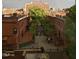 A charming brick alley with lush trees and buildings at 512 Gordon St # 302, Durham, NC 27701