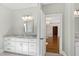 Bathroom with white vanity, granite countertop, and mirror at 3700 Lark Farm Rd, Franklinton, NC 27525