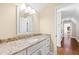 Bathroom with granite countertop and white cabinets at 3700 Lark Farm Rd, Franklinton, NC 27525