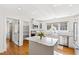 Bright kitchen features white cabinets, stainless steel appliances, and an island at 3700 Lark Farm Rd, Franklinton, NC 27525