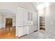 Butlers pantry with white shaker cabinets and granite countertops at 3700 Lark Farm Rd, Franklinton, NC 27525
