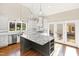 Spacious kitchen with white cabinets, large island, and stainless steel appliances at 3700 Lark Farm Rd, Franklinton, NC 27525