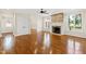 Living room with hardwood floors and stone fireplace at 3700 Lark Farm Rd, Franklinton, NC 27525