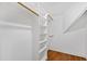 Walk-in closet with wooden shelves and hanging rods at 3700 Lark Farm Rd, Franklinton, NC 27525