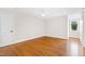 Spacious bedroom with hardwood floors and a large window at 3700 Lark Farm Rd, Franklinton, NC 27525