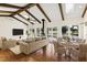 Great room with exposed beams, hardwood floors, and pond views at 3700 Lark Farm Rd, Franklinton, NC 27525
