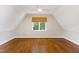 Spacious bedroom with hardwood floors, window, and ceiling fan at 3700 Lark Farm Rd, Franklinton, NC 27525