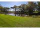 Expansive pond surrounded by trees at 3700 Lark Farm Rd, Franklinton, NC 27525