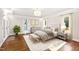 Main bedroom with hardwood floors and stylish decor at 3700 Lark Farm Rd, Franklinton, NC 27525