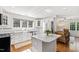 Spacious kitchen with white cabinets, stainless steel appliances, and a large island at 3700 Lark Farm Rd, Franklinton, NC 27525