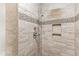 Walk-in shower with tile surround and multiple shower heads at 3700 Lark Farm Rd, Franklinton, NC 27525
