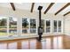 Great room with exposed beams, hardwood floors, and pond views at 3700 Lark Farm Rd, Franklinton, NC 27525
