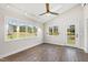 Sunroom with wood floors, multiple windows, and a view at 3700 Lark Farm Rd, Franklinton, NC 27525