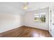 Bright bedroom with hardwood floors and a ceiling fan at 3700 Lark Farm Rd, Franklinton, NC 27525