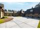 Luxury home with stone and shingle exterior, multiple garages and expansive driveway at 3700 Lark Farm Rd, Franklinton, NC 27525