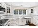 Modern kitchen with white cabinets, stainless steel appliances, and subway tile backsplash at 3700 Lark Farm Rd, Franklinton, NC 27525