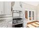 Kitchen with stainless steel range and white cabinets at 3700 Lark Farm Rd, Franklinton, NC 27525