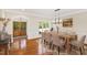 Dining room features hardwood floors and a modern table setting at 3700 Lark Farm Rd, Franklinton, NC 27525