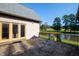 Stone patio overlooking pond at 3700 Lark Farm Rd, Franklinton, NC 27525