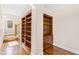 Built-in shelving and hardwood floors in the library at 3700 Lark Farm Rd, Franklinton, NC 27525