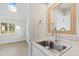 Small wet bar with sink and mirror at 3700 Lark Farm Rd, Franklinton, NC 27525