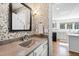 Stylish powder room with patterned wallpaper and a pedestal sink at 3700 Lark Farm Rd, Franklinton, NC 27525