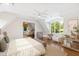 Main bedroom with hardwood floors, large window, and ceiling fan at 3700 Lark Farm Rd, Franklinton, NC 27525