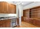 Wet bar with granite countertop and wine cooler at 3700 Lark Farm Rd, Franklinton, NC 27525