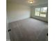 Spacious bedroom with carpeted floors and a window at 23 Quail Pt Cir, Clayton, NC 27520