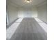 Bright bonus room featuring carpet and double doors at 23 Quail Pt Cir, Clayton, NC 27520