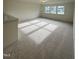 Spacious bonus room with carpet and multiple windows offering natural light at 23 Quail Pt Cir, Clayton, NC 27520