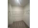 Walk-in closet with wire shelving offering convenient storage at 23 Quail Pt Cir, Clayton, NC 27520
