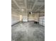 Unfinished garage with access to the house at 23 Quail Pt Cir, Clayton, NC 27520
