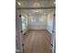 Home office with hardwood floors, wainscoting, and natural light at 23 Quail Point Cr, Clayton, NC 27520