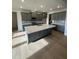 Spacious kitchen with large island and gray cabinets at 23 Quail Pt Cir, Clayton, NC 27520