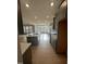 Modern kitchen with island, stainless steel appliances, and ample counter space at 23 Quail Pt Cir, Clayton, NC 27520